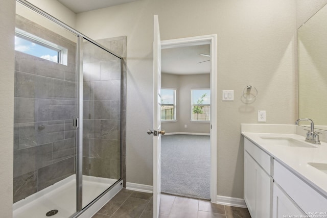 139 Perciful Ave, Cibolo, TX 78108 - bathroom with double vanity, a shower stall, and baseboards