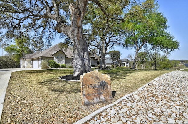 1609 Havenwood, New Braunfels, TX 78132 - view of front of house with driveway, a garage, and a front lawn