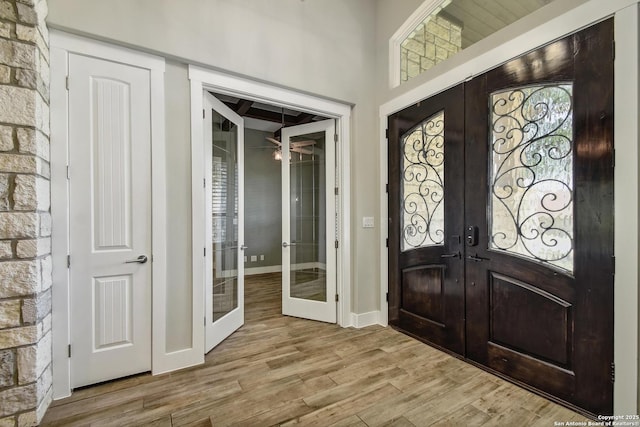 1609 Havenwood, New Braunfels, TX 78132 - foyer with french doors, baseboards, and wood finished floors