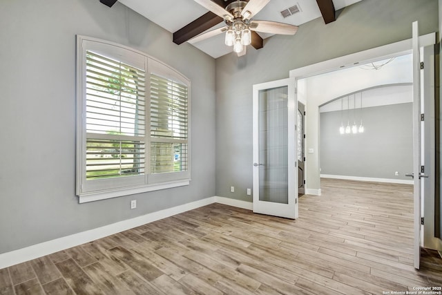 1609 Havenwood, New Braunfels, TX 78132 - spare room featuring french doors, wood finished floors, visible vents, beamed ceiling, and ceiling fan