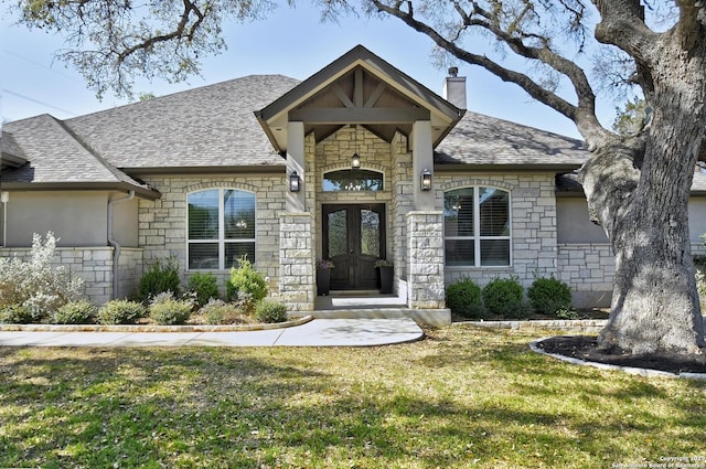 1609 Havenwood, New Braunfels, TX 78132 - entrance to property featuring a lawn, a chimney, stone siding, and roof with shingles
