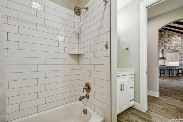 1609 Havenwood, New Braunfels, TX 78132 - bathroom featuring baseboards, wood finished floors, and shower / bath combination