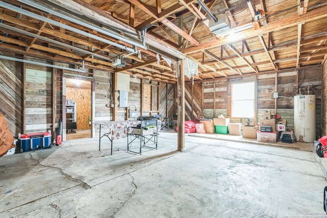 misc room featuring water heater and a garage