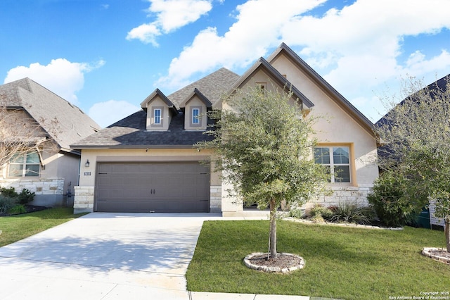 french provincial home featuring stone siding, stucco siding, and a front yard
