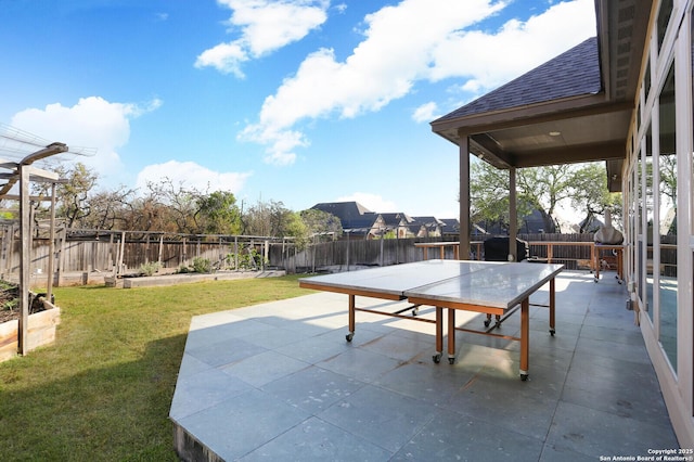 view of patio / terrace with a garden, a fenced backyard, and outdoor dining space