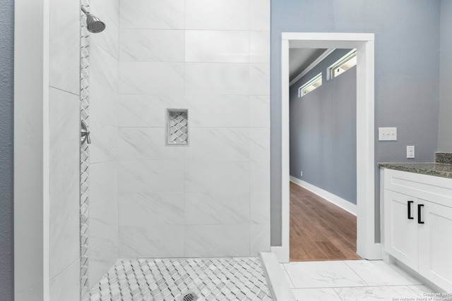 129 Cincinnati, San Antonio, TX 78201 - full bath with baseboards, tiled shower, and vanity