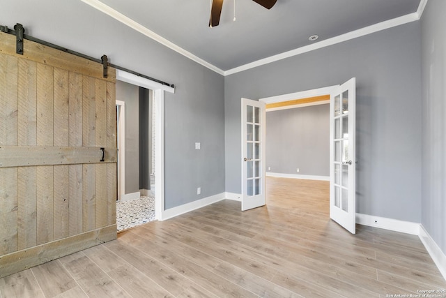 129 Cincinnati, San Antonio, TX 78201 - unfurnished room with french doors, a barn door, light wood-type flooring, ceiling fan, and ornamental molding