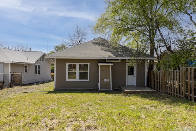 129 Cincinnati, San Antonio, TX 78201 - rear view of house featuring a lawn and fence