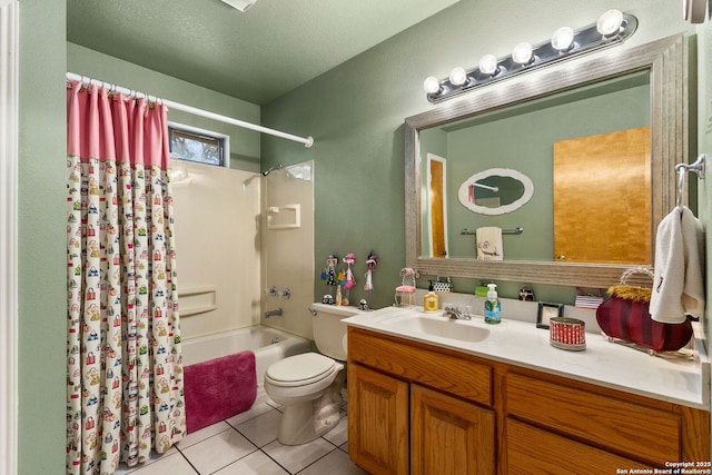 full bathroom featuring tile patterned flooring, vanity, toilet, a textured ceiling, and shower / bath combination with curtain