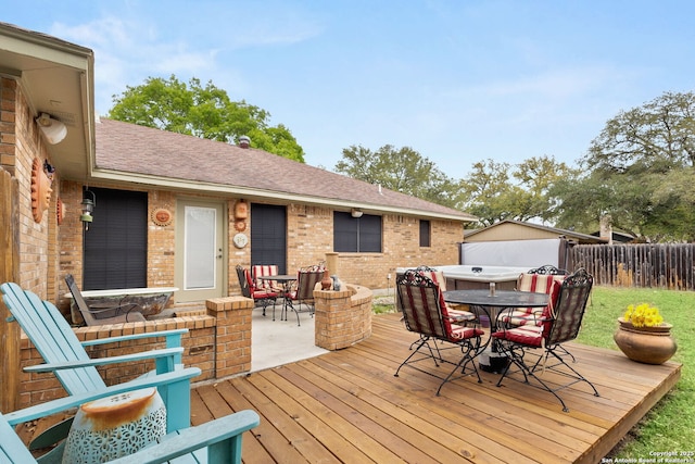 wooden terrace with fence and outdoor dining space