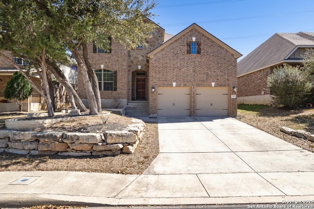view of front of house featuring brick siding and concrete driveway