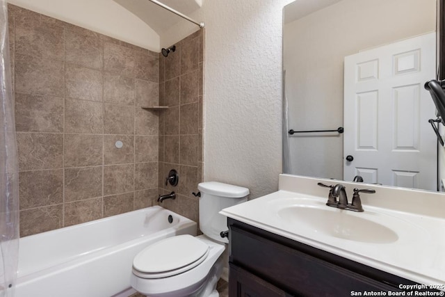 full bathroom featuring a textured wall, toilet, vanity, and shower / bathtub combination