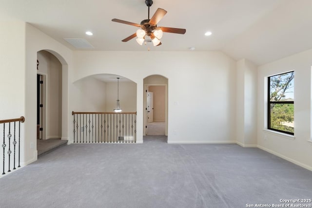 empty room with baseboards, lofted ceiling, recessed lighting, and a ceiling fan