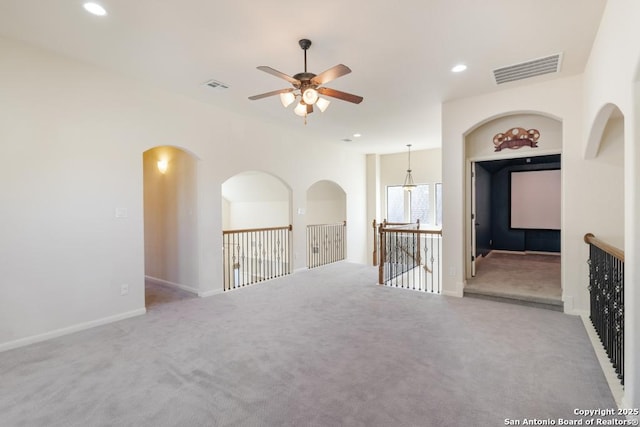 carpeted empty room featuring recessed lighting, ceiling fan, and visible vents