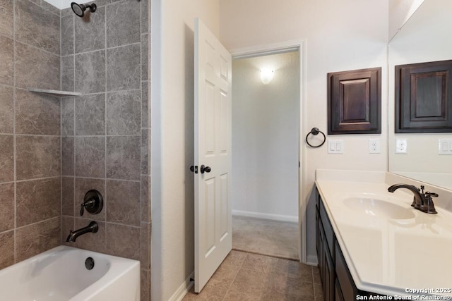bathroom featuring bathtub / shower combination, baseboards, vanity, and tile patterned flooring
