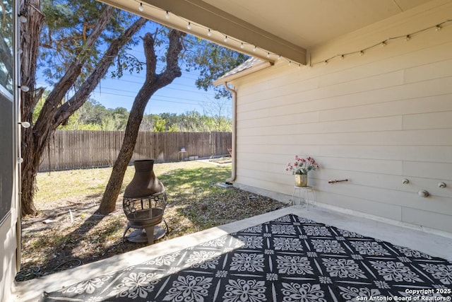 view of patio / terrace featuring fence