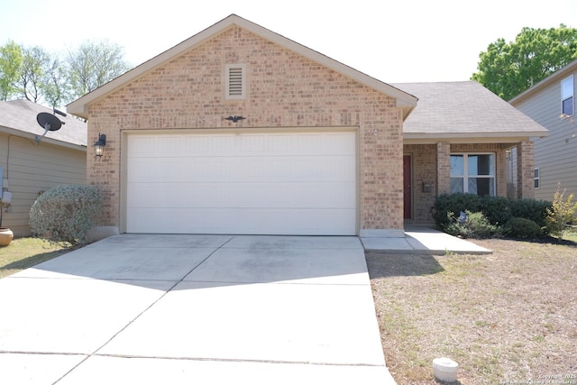 ranch-style home with brick siding, concrete driveway, and a garage