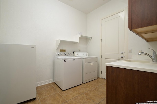 4630 Grass Fight, San Antonio, TX 78253 - laundry area with light tile patterned floors, a sink, cabinet space, and washer and dryer