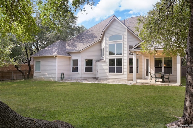 4630 Grass Fight, San Antonio, TX 78253 - back of property with a patio, a shingled roof, fence, and a yard