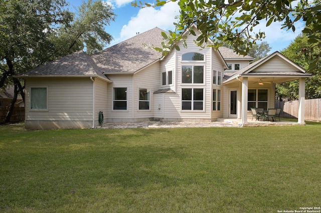 4630 Grass Fight, San Antonio, TX 78253 - back of property with fence, a patio, ceiling fan, a lawn, and a shingled roof