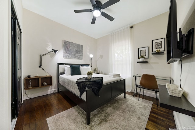 bedroom with wood-type flooring, baseboards, and ceiling fan