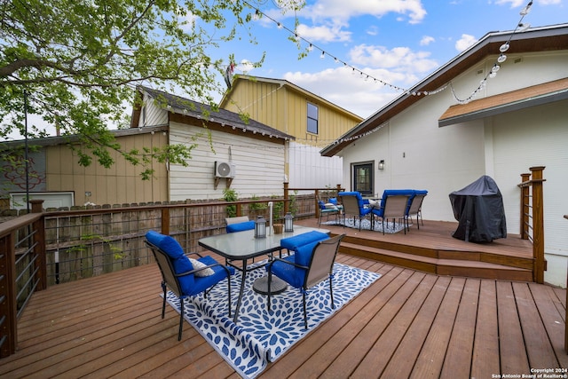 wooden deck featuring outdoor dining area