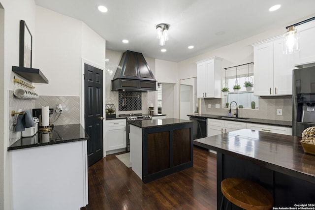 kitchen with dark wood-style flooring, white cabinets, stainless steel electric range, and premium range hood