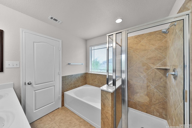13612 Sungrove Vw, San Antonio, TX 78245 - bathroom featuring a shower stall, tile patterned floors, visible vents, and a bath