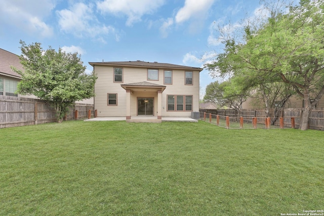 13612 Sungrove Vw, San Antonio, TX 78245 - back of property with a fenced backyard, a patio area, and a yard