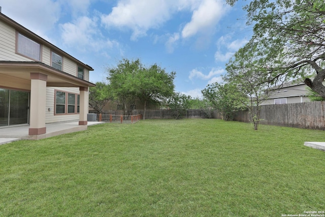13612 Sungrove Vw, San Antonio, TX 78245 - view of yard featuring a patio, central AC unit, and a fenced backyard