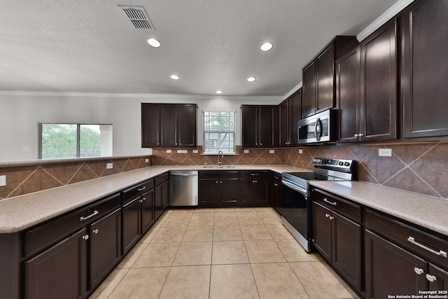 13612 Sungrove Vw, San Antonio, TX 78245 - kitchen featuring decorative backsplash, visible vents, appliances with stainless steel finishes, a sink, and light tile patterned floors