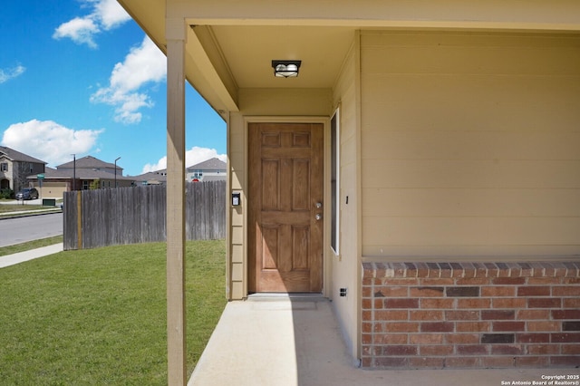 180 Elderberry, New Braunfels, TX 78130 - doorway to property featuring fence and a yard