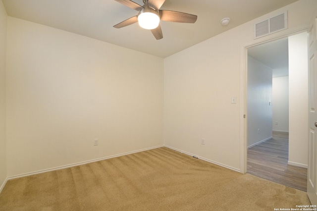 180 Elderberry, New Braunfels, TX 78130 - unfurnished room featuring light carpet, baseboards, visible vents, and ceiling fan