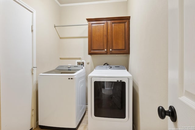 laundry area with cabinet space and washer and dryer
