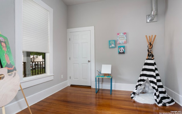 144 Ward Ave, San Antonio, TX 78223 - playroom featuring baseboards and wood finished floors