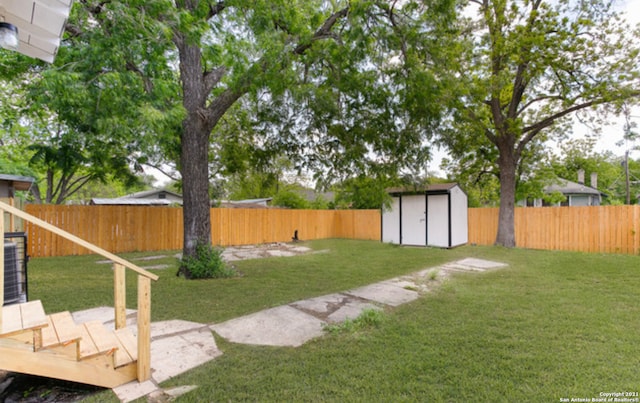 144 Ward Ave, San Antonio, TX 78223 - view of yard with a fenced backyard, an outdoor structure, and a storage shed