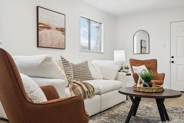 living room featuring wood finished floors and ornamental molding