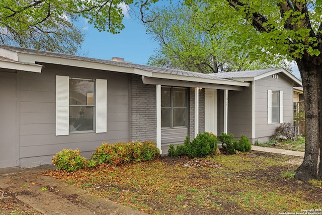 view of front of house featuring brick siding