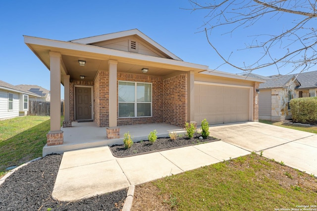 2297 Olive Hl, New Braunfels, TX 78130 - view of front facade with driveway, brick siding, a garage, a front lawn, and a porch