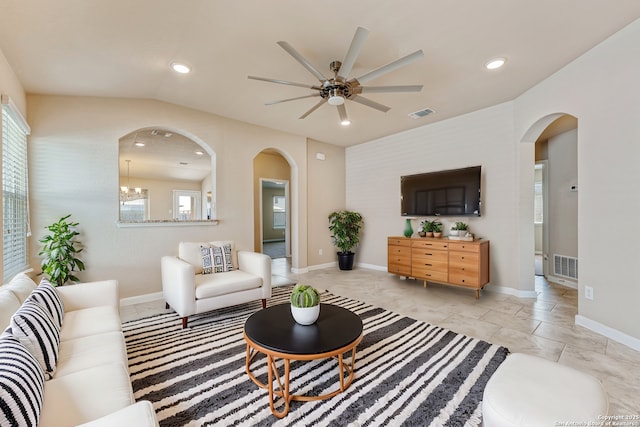 2297 Olive Hl, New Braunfels, TX 78130 - living room featuring arched walkways, ceiling fan, visible vents, and a wealth of natural light
