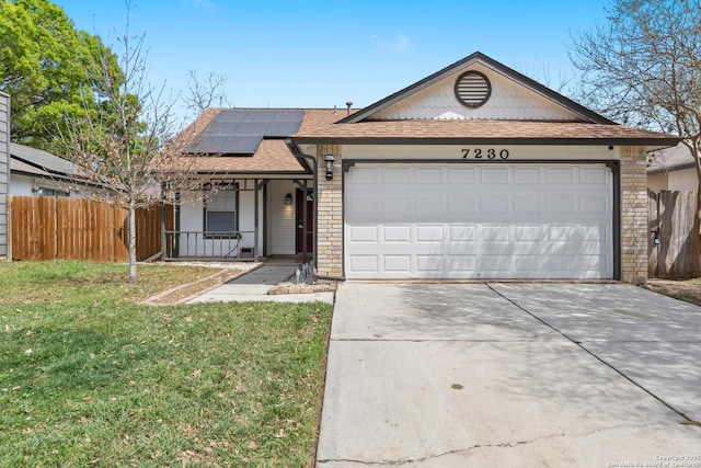ranch-style house with fence, a front yard, solar panels, covered porch, and a garage
