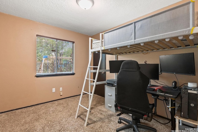 carpeted bedroom featuring a textured ceiling