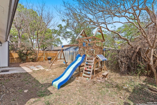 view of jungle gym with a fenced backyard