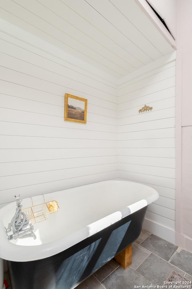 bathroom with a soaking tub