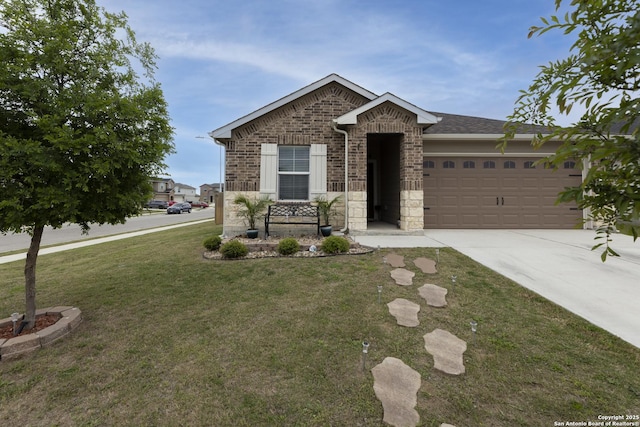 view of front of home with brick siding, a front yard, driveway, and a garage