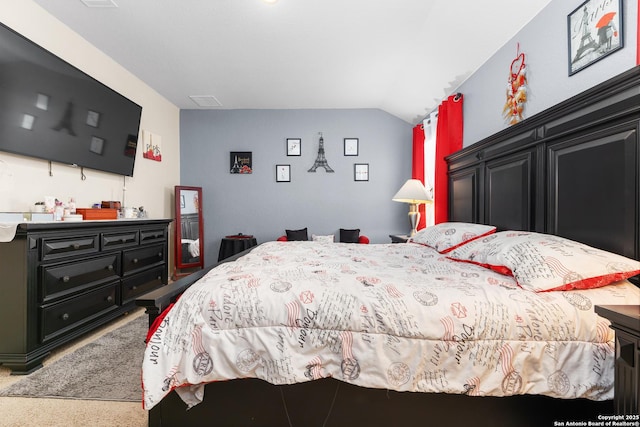 bedroom featuring lofted ceiling