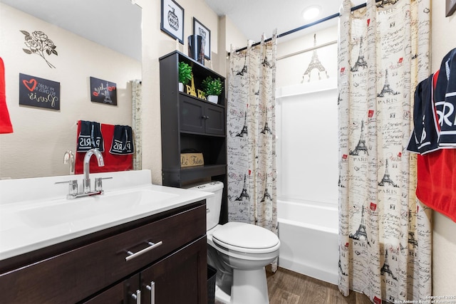 bathroom with shower / bath combo, wood finished floors, toilet, and vanity