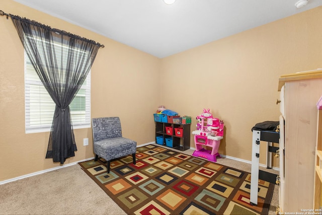 playroom featuring carpet flooring and baseboards