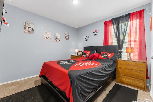 bedroom featuring carpet floors and baseboards