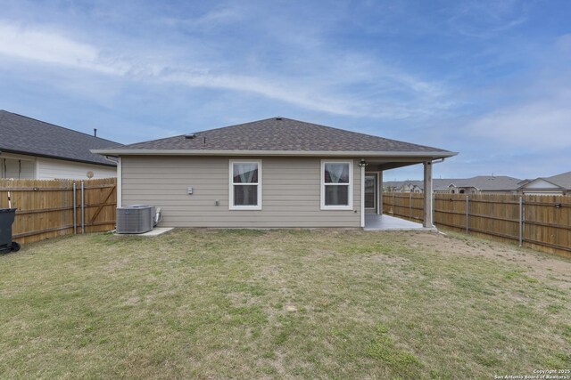 back of property featuring cooling unit, a fenced backyard, a yard, and a patio area